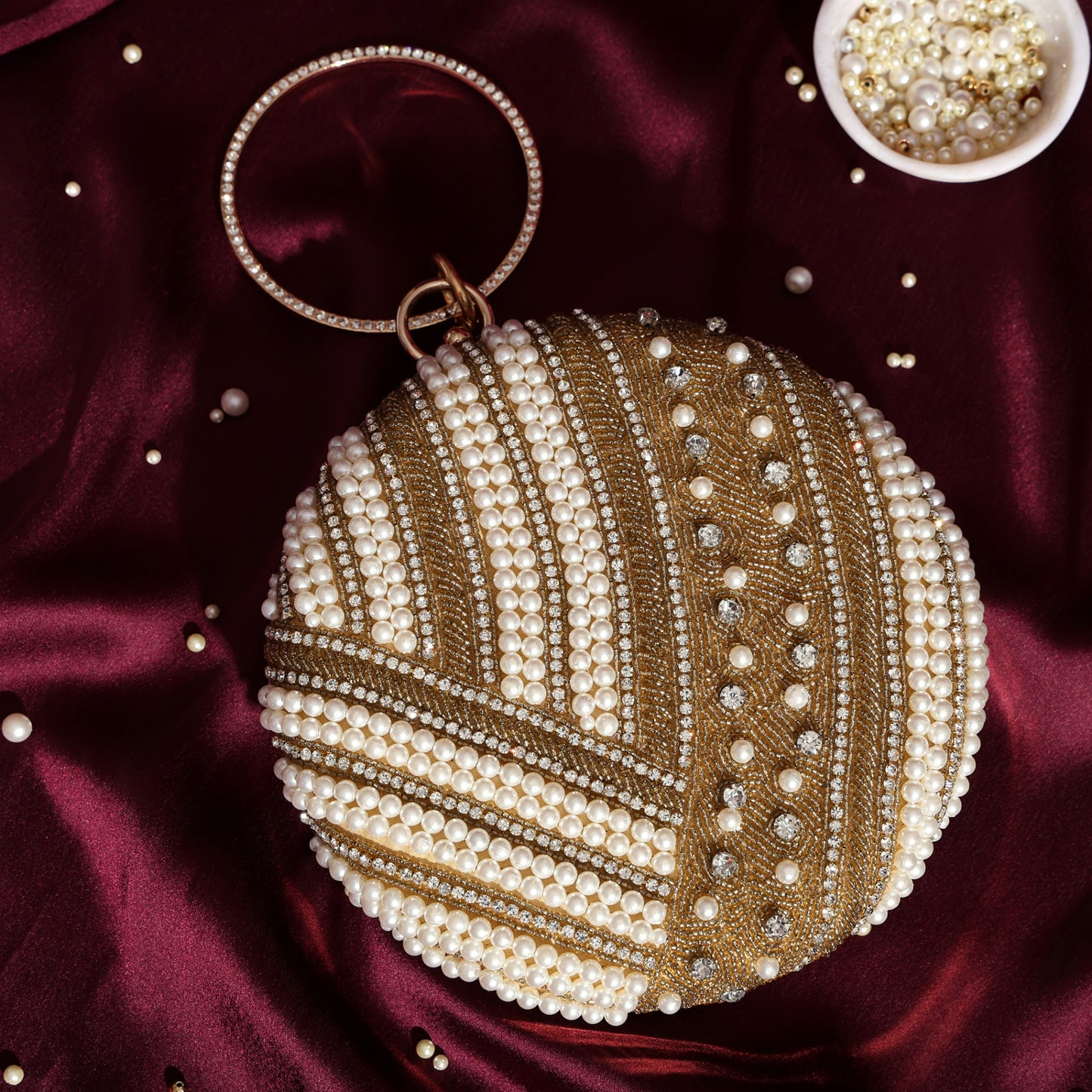 Noorika Handcrafted Round Pearl Clutch with Crystal Embellishments