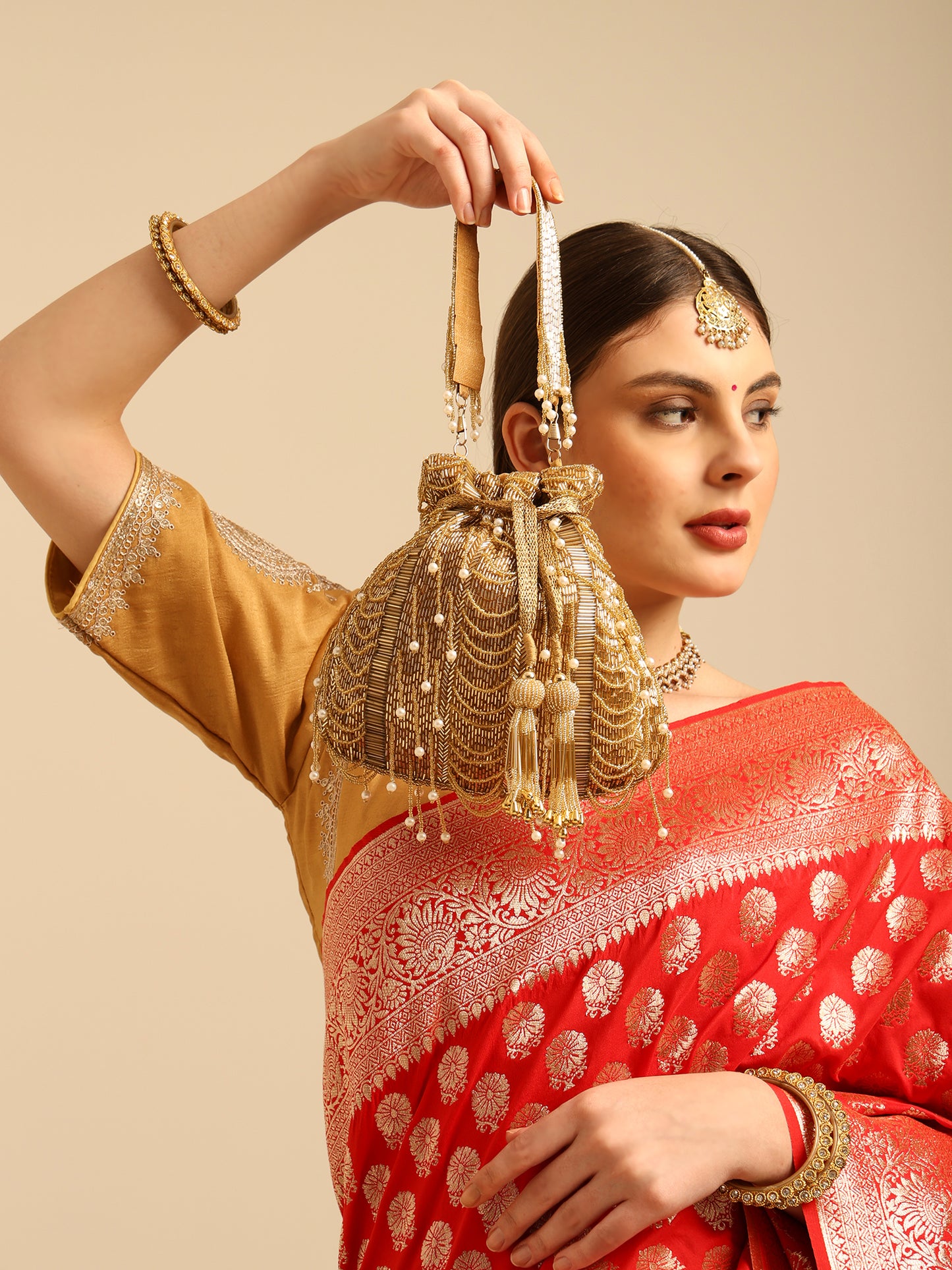 Women Golden Beaded Potli Bag with Pearl Tassels