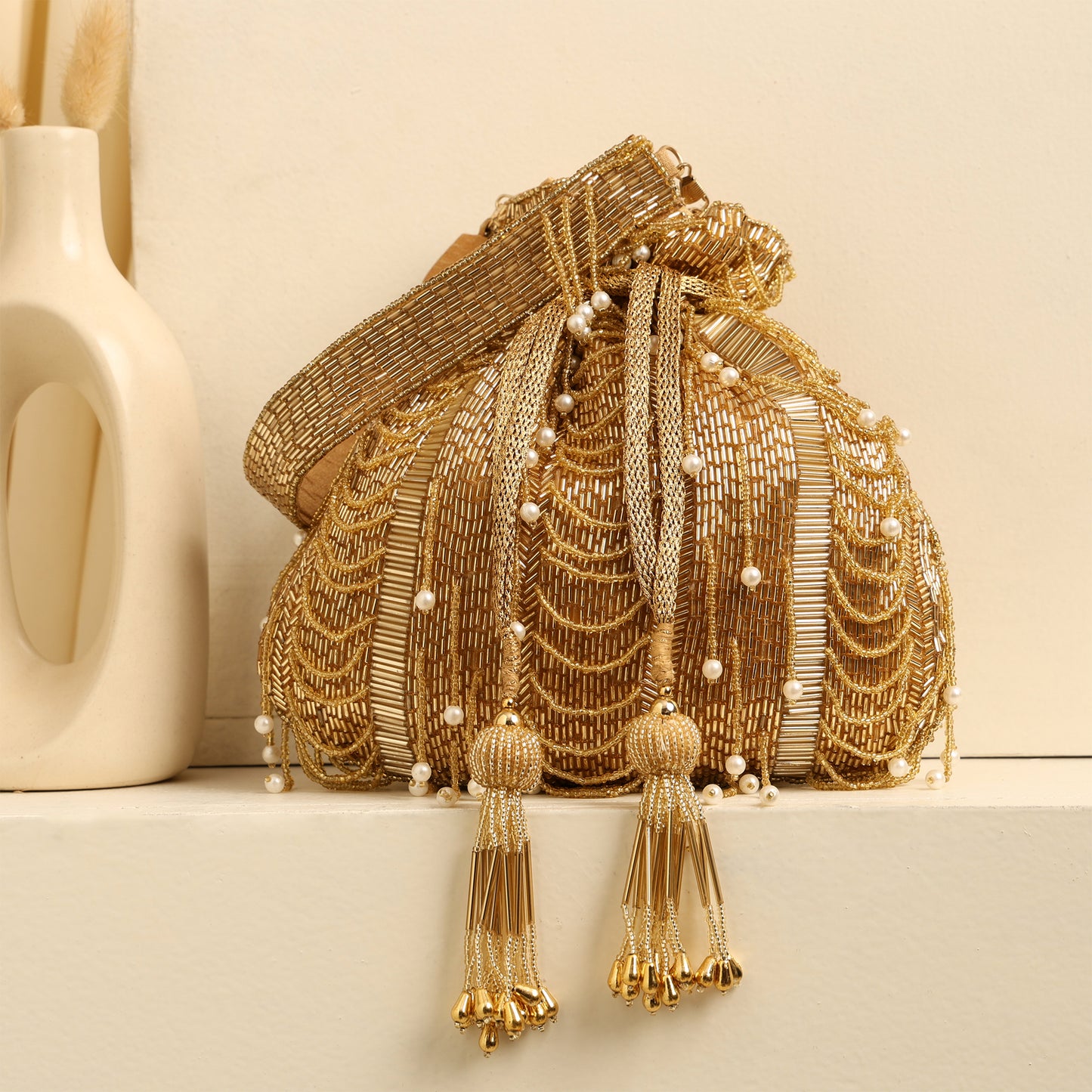 Women Golden Beaded Potli Bag with Pearl Tassels