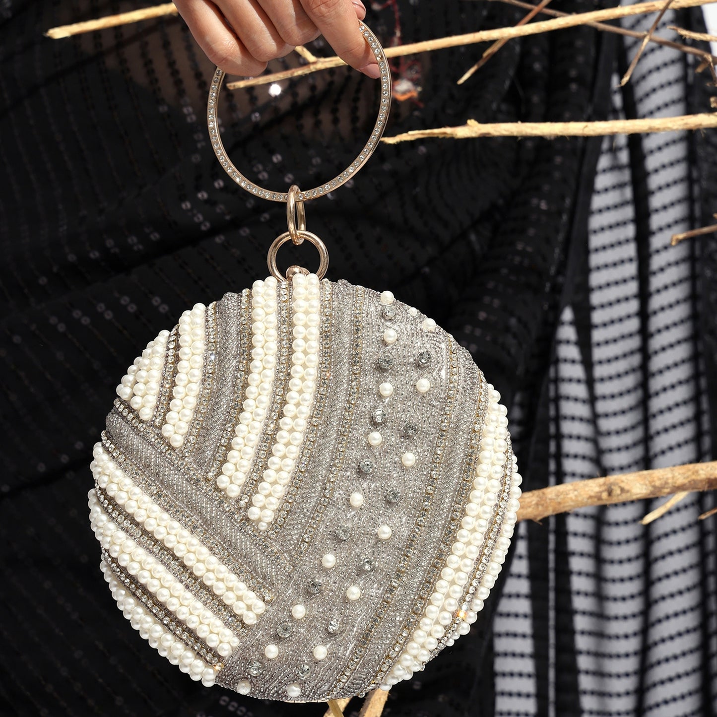 Noorika Handcrafted Round Pearl Clutch with Crystal Embellishments