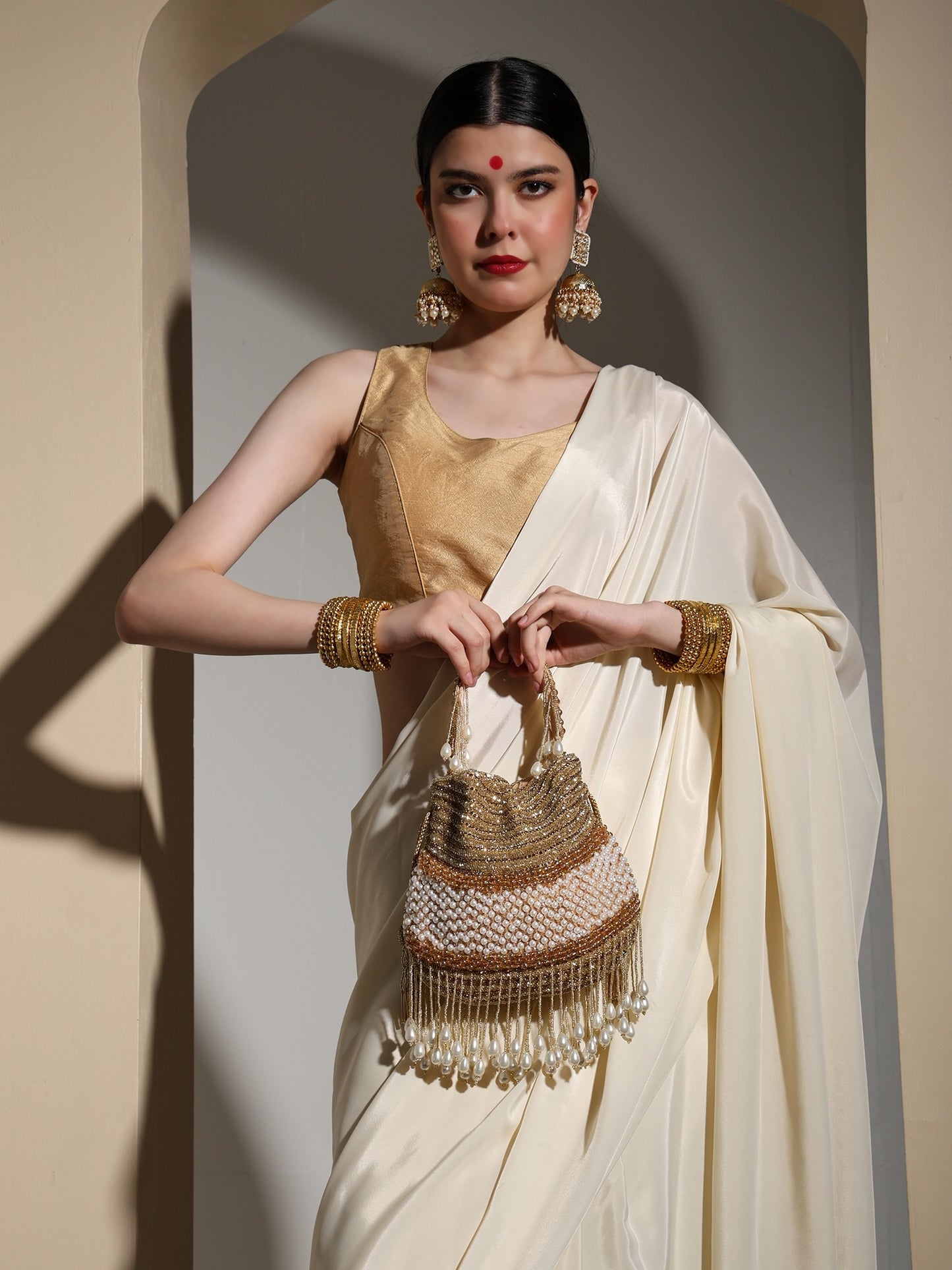 Gold Gleam Handcrafted Potli Bag with Pearl Tassels for Women