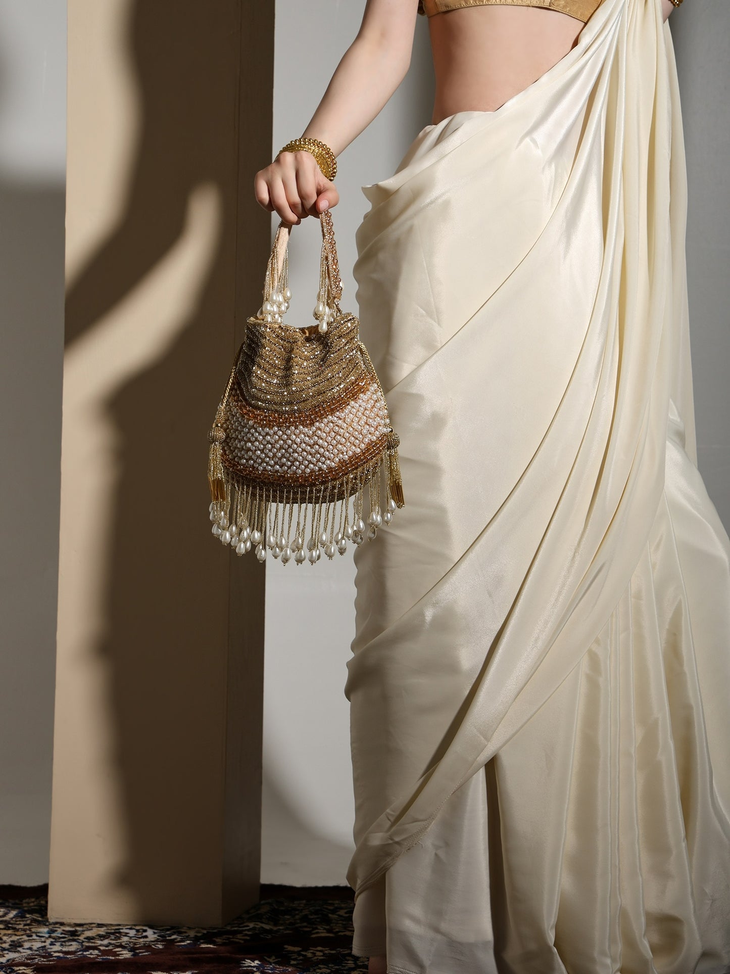 Gold Gleam Handcrafted Potli Bag with Pearl Tassels for Women